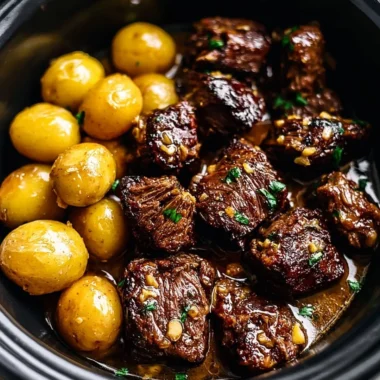 Garlic Butter Beef Bites served with golden roasted potatoes