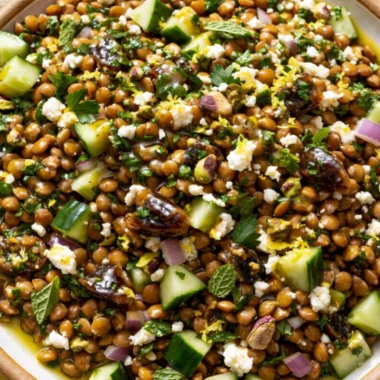 Cozy lentil salad with feta cheese in a bowl garnished with fresh herbs
