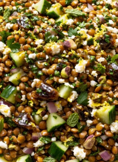 Cozy lentil salad with feta cheese in a bowl garnished with fresh herbs