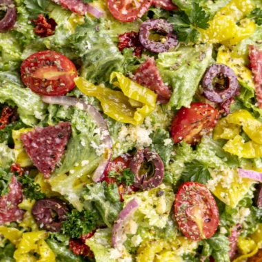 A delicious Classic Italian Salad with fresh vegetables and Italian dressing.
