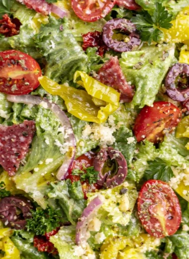 A delicious Classic Italian Salad with fresh vegetables and Italian dressing.