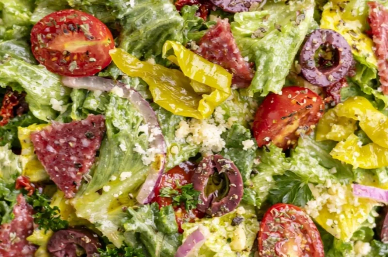 A delicious Classic Italian Salad with fresh vegetables and Italian dressing.