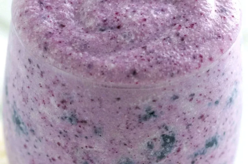 Healthy blueberry banana smoothie with protein ingredients in a glass