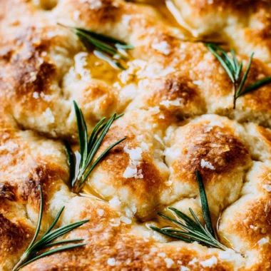 Freshly baked same-day sourdough focaccia bread with herbs and olive oil