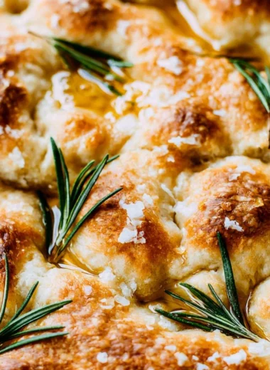 Freshly baked same-day sourdough focaccia bread with herbs and olive oil