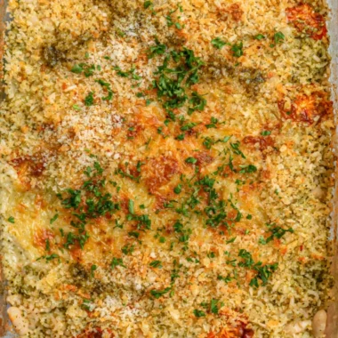 Cozy white bean and pesto bake served in a rustic dish