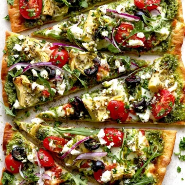 Delicious Mediterranean flatbread pizza with fresh toppings.