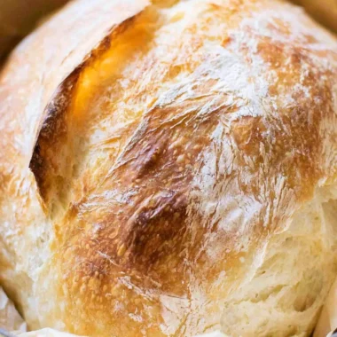 Homemade no-fail sourdough bread loaves on a wooden table