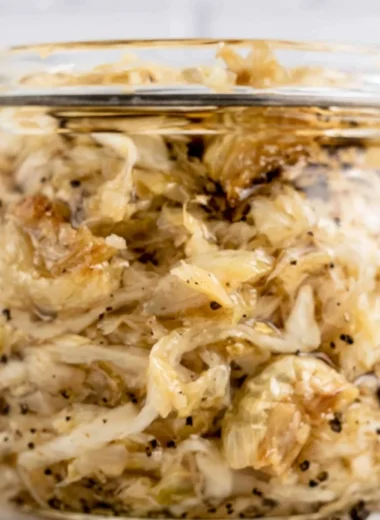 Delicious Roasted Garlic Sauerkraut in a bowl, showcasing rich flavors and vibrant color.