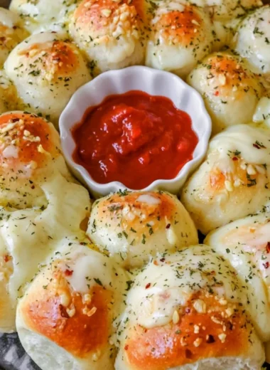 Cheesy garlic monkey bread with golden, flaky pieces ready to be enjoyed.