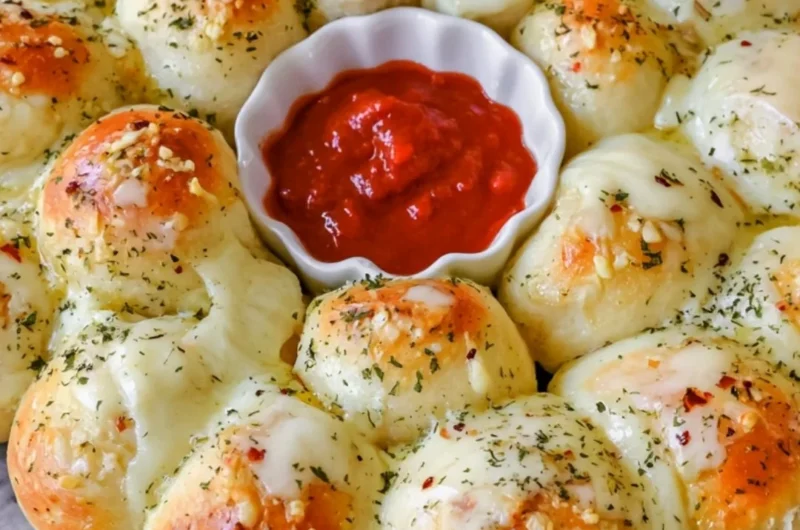 Cheesy garlic monkey bread with golden, flaky pieces ready to be enjoyed.