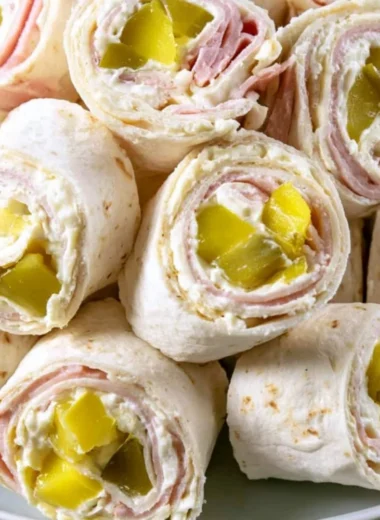 Cozy pickle dip pinwheels ready to serve at a party