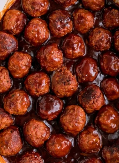 Three-ingredient grape jelly meatballs served on a platter